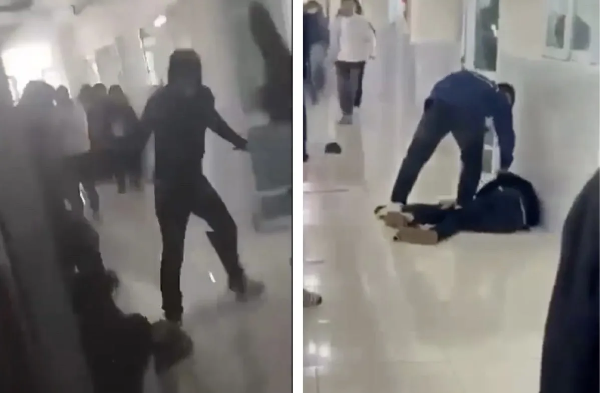 Nam sinh trường ĐH Tài nguyên và Môi trường Hà Nội xảy ra xô xát tại khuôn viên trường (Ảnh cắt từ clip)