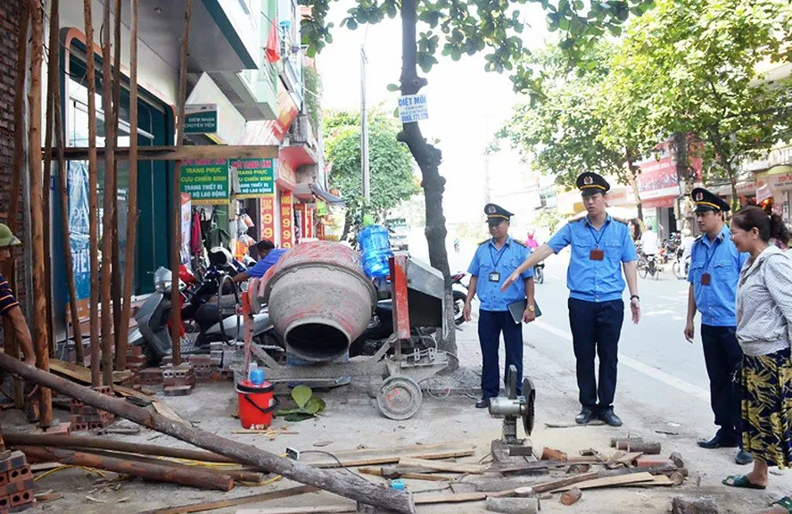 Mô hình Đội Quản lý trật tự xây dựng đô thị trực thuộc UBND quận, huyện, thị xã ngày càng phát huy hiệu quả. Ảnh: Thanh Hà