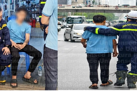 Hà Nội: giải cứu nam thanh niên có hành động bất thường trên lan can cầu vượt phố Vọng